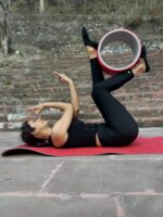 The-Yogis-Red-Gray-Eva-Foam-Yoga-Wheel-Long-color-A black-Color-Dress-with-Girl-doing-Yoga-Pose-In-Wheel-